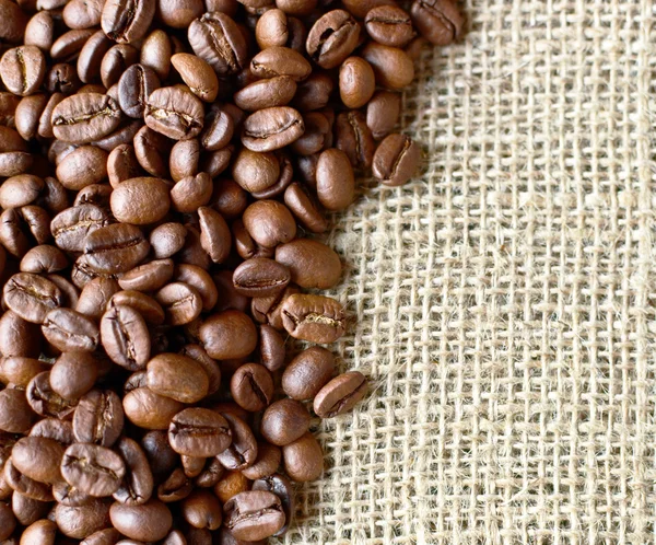 Sack and coffee beans background — Stock Photo, Image
