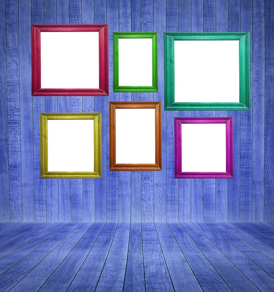 Retro room with colorful blank picture frames — Stock Photo, Image