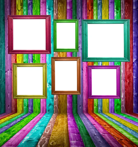 Retro colorful wood room with multicolored photo frames — Stock Photo, Image