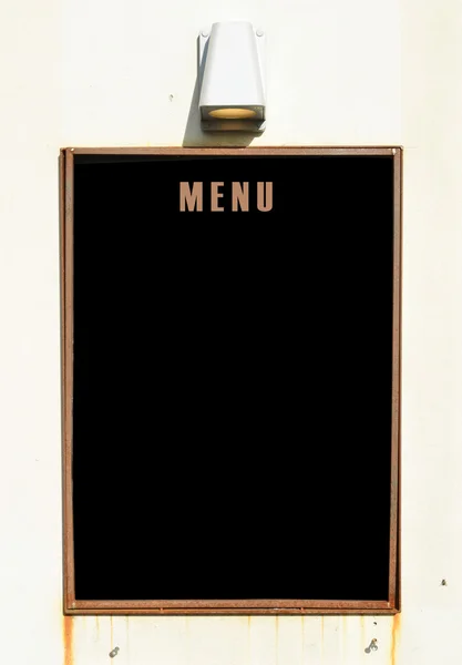 Empty menu board on wall — Stock Photo, Image