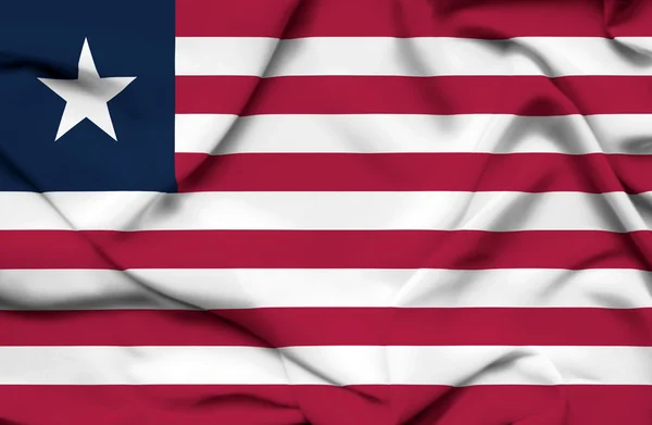 Liberia vifter med flag - Stock-foto