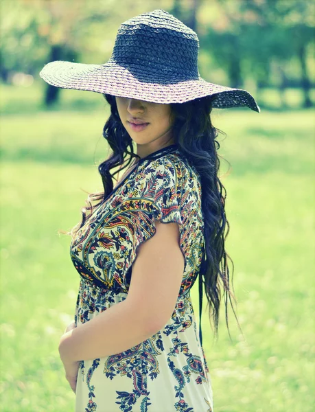 Retro image of beautiful woman in field — Stock Photo, Image