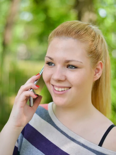Portrait of happy girl talking on phone — Stock Photo, Image