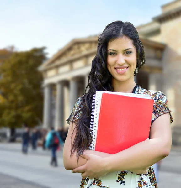 Portrait of happy student girl against street background — Stock Photo, Image