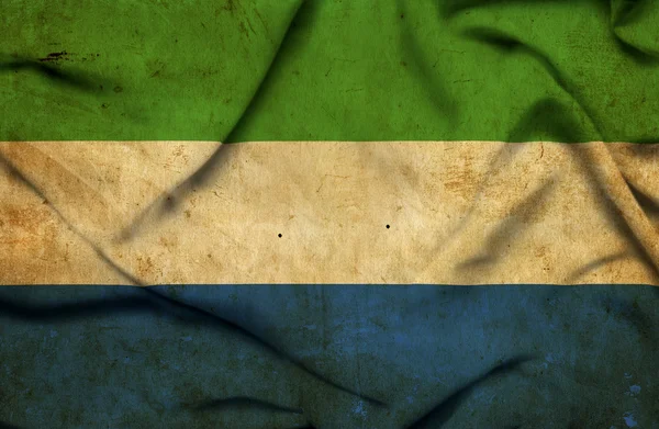 Macha flagą Sierra leone — Zdjęcie stockowe