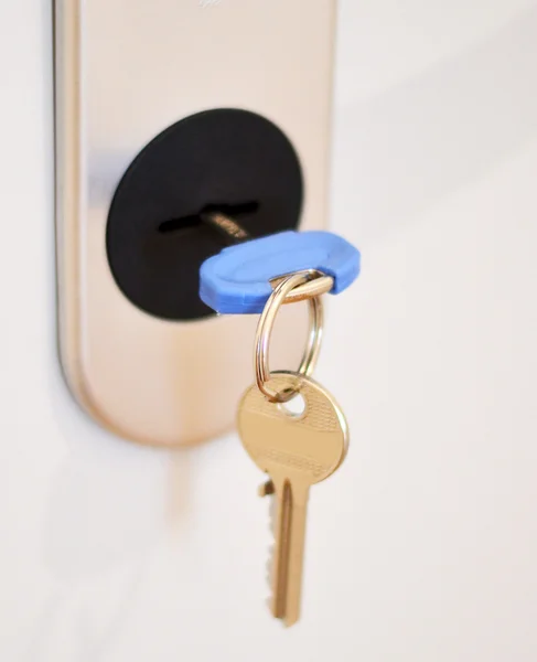 Keys in door lock - Real estate concept — Stock Photo, Image