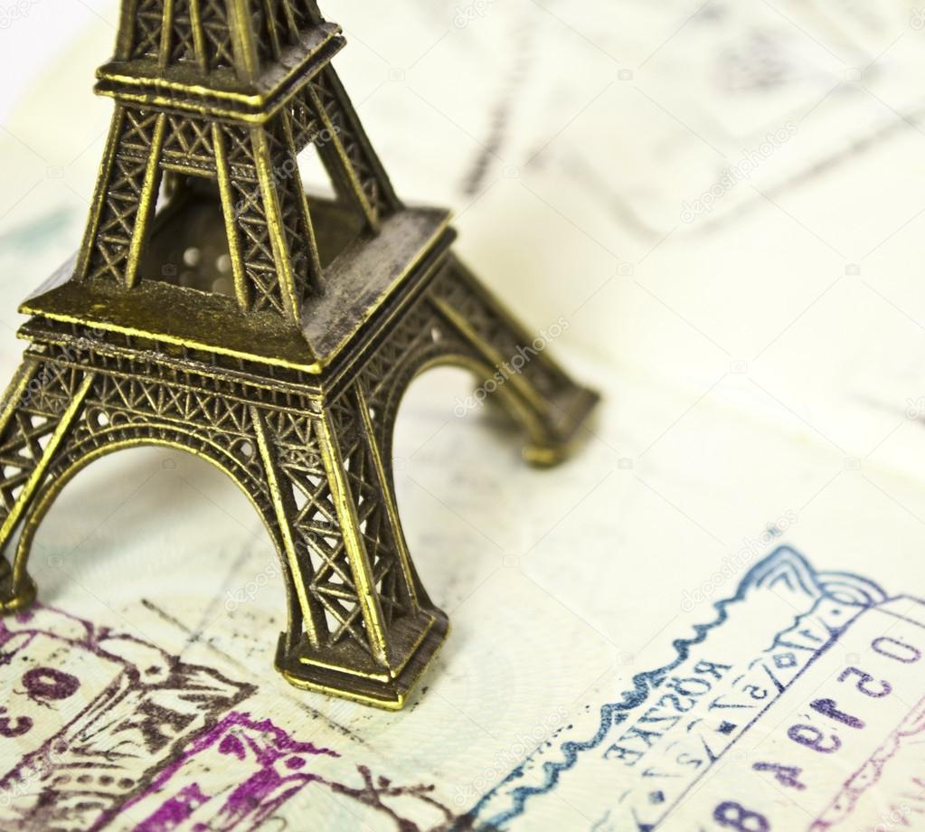 Stamped passport with Eiffel passport - Travel to Paris concept