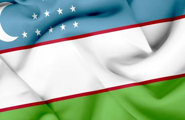 Vlající vlajka Uzbekistánu — Stock fotografie