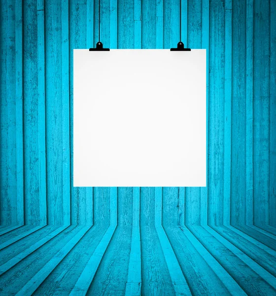 Blank board hanging at wall in blue retro room — Stock Photo, Image