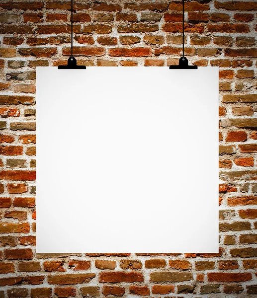 Interior of grunge empty room with empty board hanging on brick — Stock Photo, Image