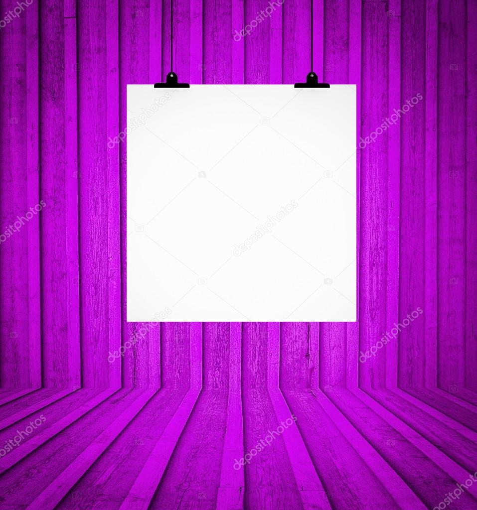 Blank board hanging at wall in purple retro room