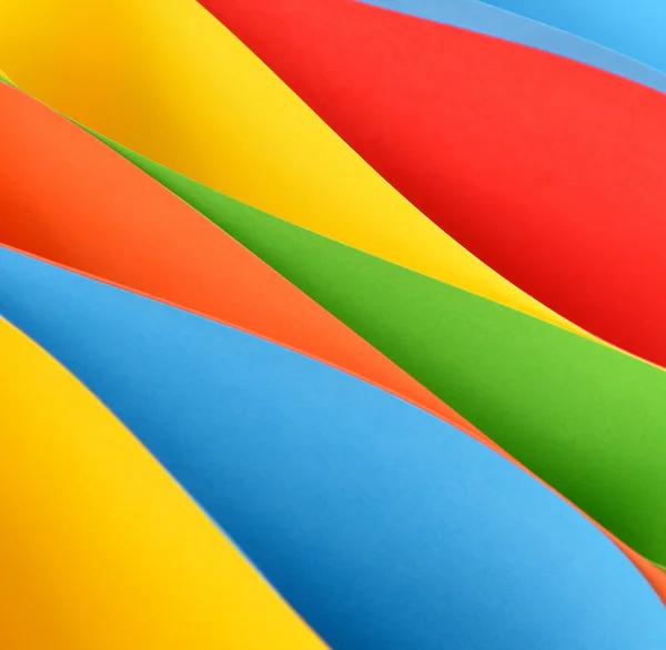 Multicolored papers forming abstract background — Stock Photo, Image