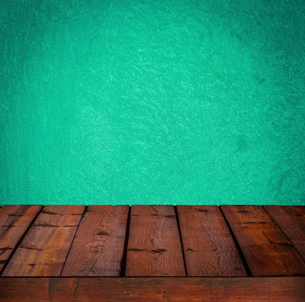 Tło z drewnianym stołem i cyjan granica ściany — Zdjęcie stockowe