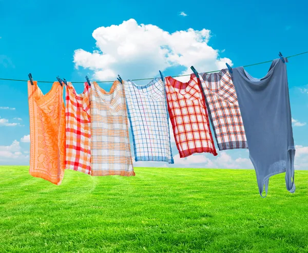 Laundry hanging over vivid landscape — Stock Photo, Image