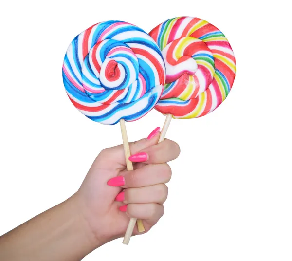 Woman hand golding two lollipops — Stock Photo, Image