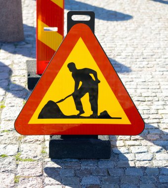 Work in progress sign on road clipart