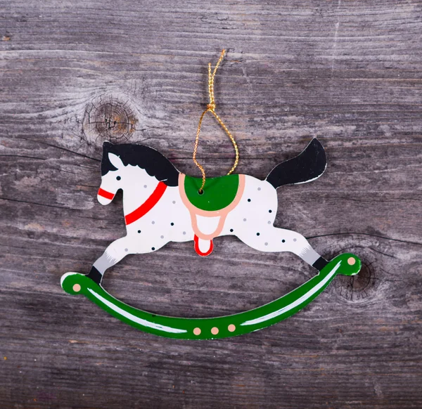 Christmas decorative ornament - Horse ornament on wooden backgro — Stock Photo, Image