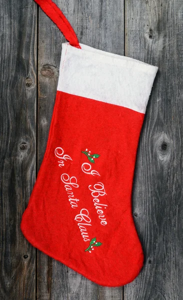 Christmas stocking on wooden background — Stock Photo, Image