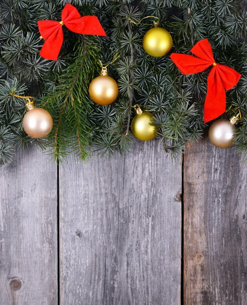 Christmas fir tree with decoration on a wooden board Stock Image