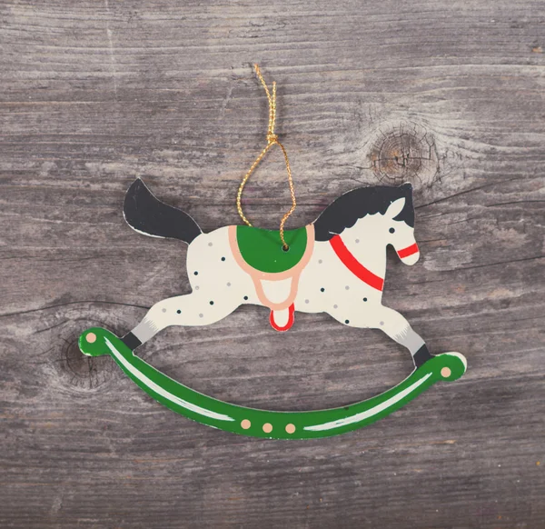 Christmas decorative ornament - Horse ornament on wooden backgro — Stock Photo, Image