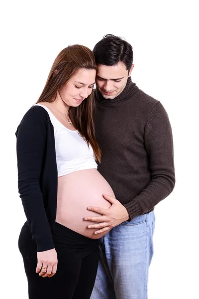 Gelukkige zwangere paar kijken naar buik — Stockfoto