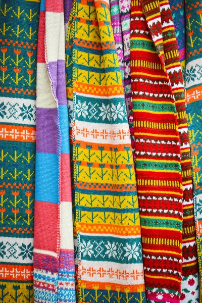 Multicolored winter scarfs background — Stock Photo, Image