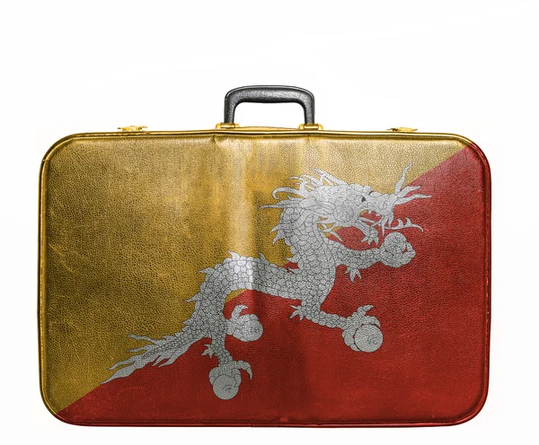 Vintage travel bag with flag of Bhutan — Stock Photo, Image