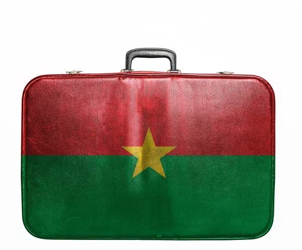 Vintage travel bag with flag of Burkina Faso — Stock Photo, Image