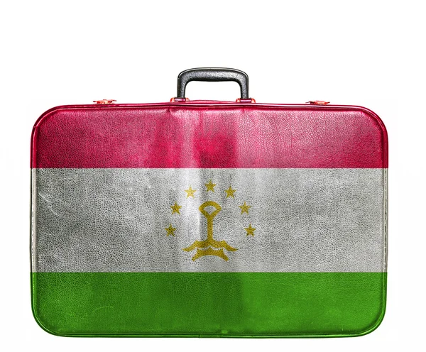 Vintage travel bag with flag of Tajikistan — Stock Photo, Image