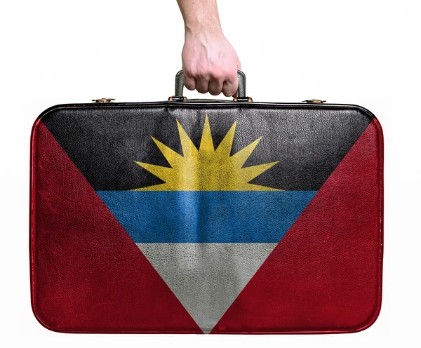 Tourist hand holding vintage leather travel bag with flag of Ant — Stock Photo, Image