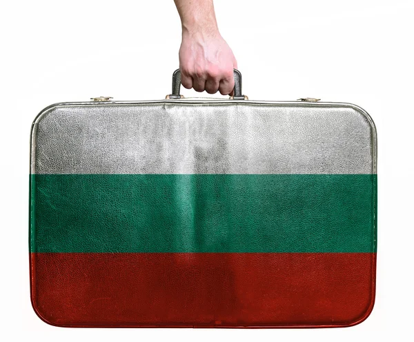 Tourist hand holding vintage leather travel bag with flag of Bul — Stock Photo, Image