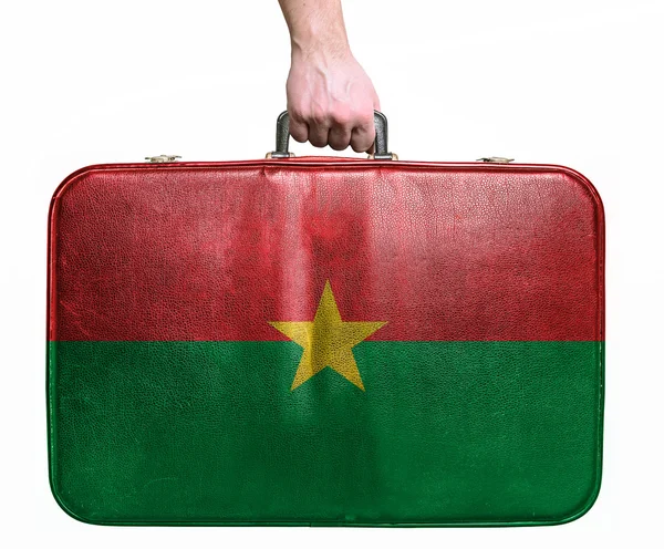 Tourist hand holding vintage leather travel bag with flag of Bur — Stock Photo, Image