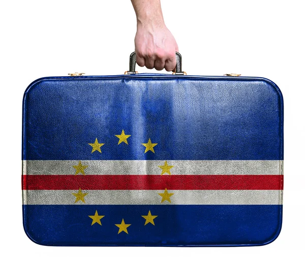 Tourist hand holding vintage leather travel bag with flag of Cap — Stock Photo, Image