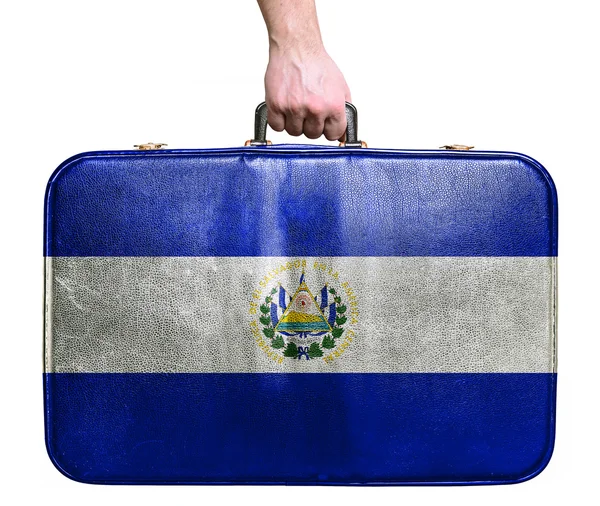 Turistické ruka drží ročník kožená cestovní taška s příznakem el — Stock fotografie