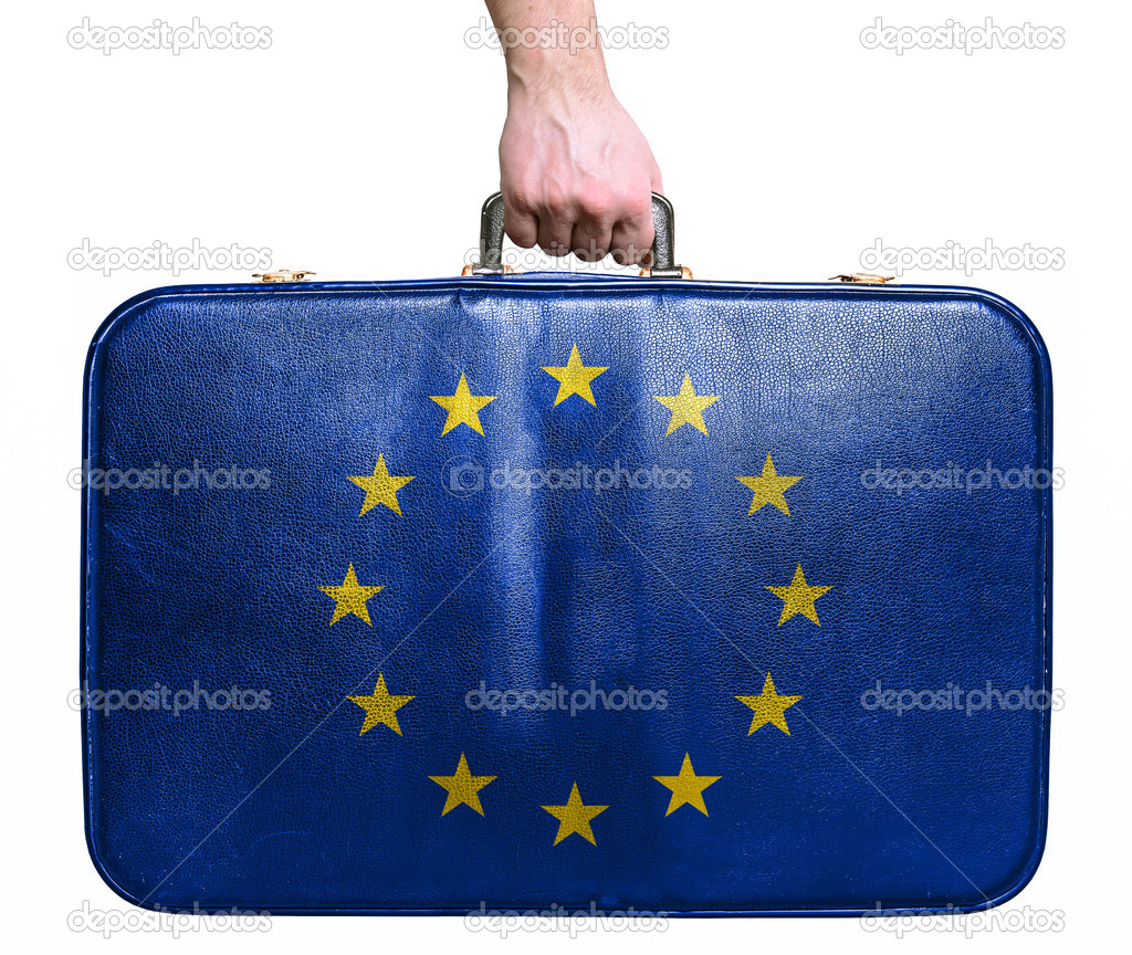 Tourist hand holding vintage leather travel bag with flag of Eur