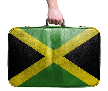 Tourist hand holding vintage leather travel bag with flag of Jam