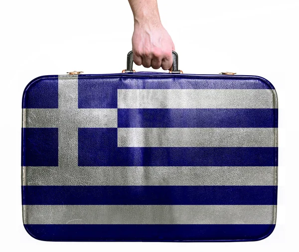 Tourist hand holding vintage leather travel bag with flag of Gre — Stock Photo, Image