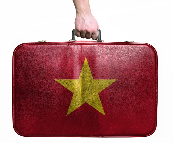 Tourist hand holding vintage leather travel bag with flag of Vie — Stock Photo, Image