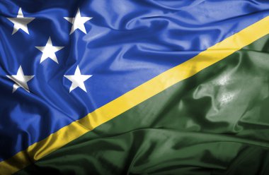 Solomon Adaları bayrağı sallayarak