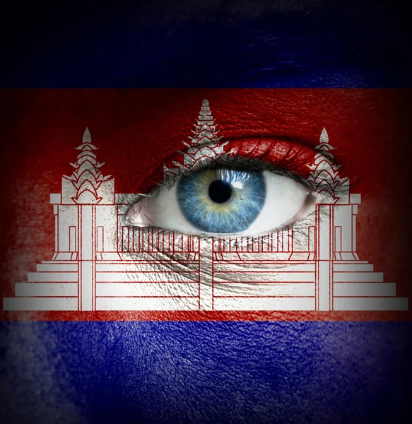 Human face painted with flag of Cambodia — Stock Photo, Image