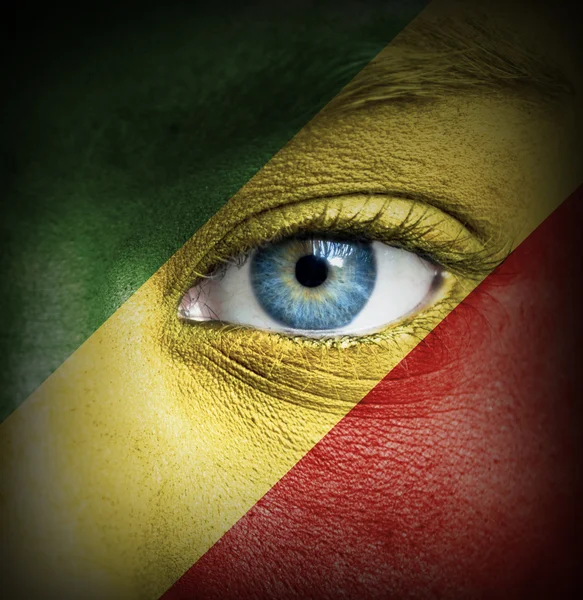 Human face painted with flag of Republic of the Congo — Stock Photo, Image