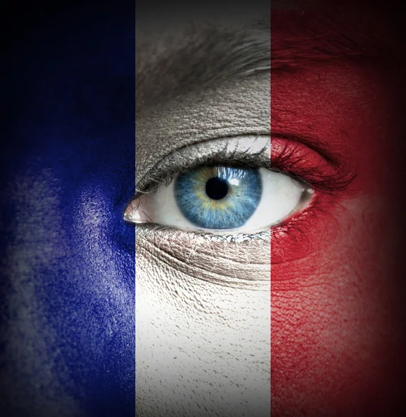 Human face painted with flag of France — Stock Photo, Image