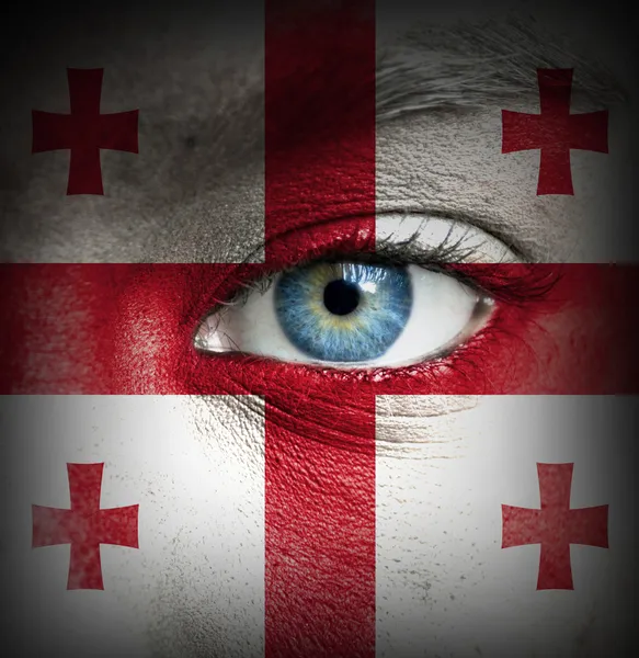 Human face painted with flag of Georgia — Stock Photo, Image