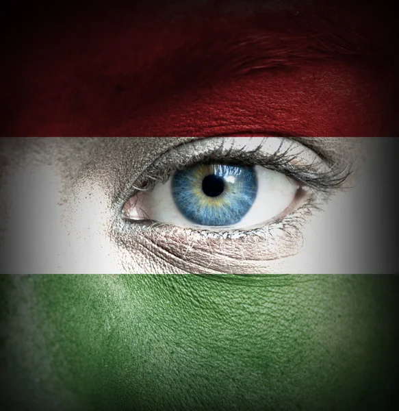 Human face painted with flag of Hungary — Stock Photo, Image