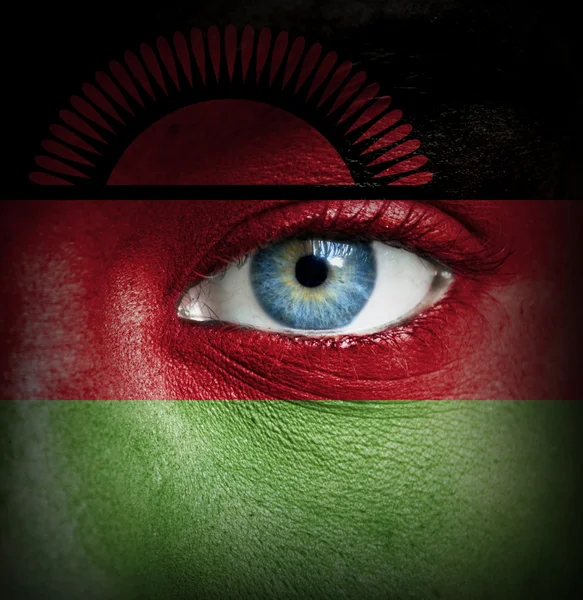 Rosto humano pintado com a bandeira do Malawi — Fotografia de Stock