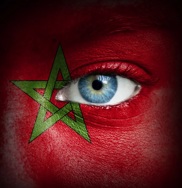 Human face painted with flag of Morocco — Stock Photo, Image