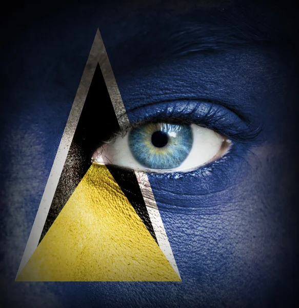 Human face painted with flag of Saint Lucia — Stock Photo, Image