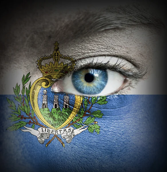 Human face painted with flag of San Marino — Stock Photo, Image