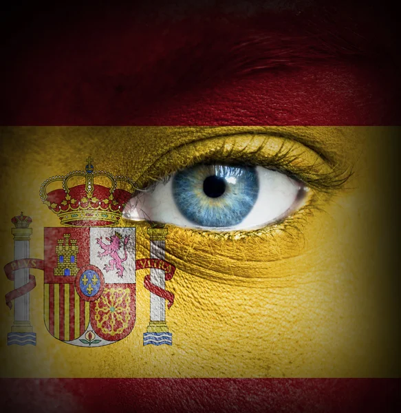 Human face painted with flag of Spain — Stock Photo, Image