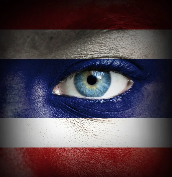 Human face painted with flag of Thailand — Stock Photo, Image